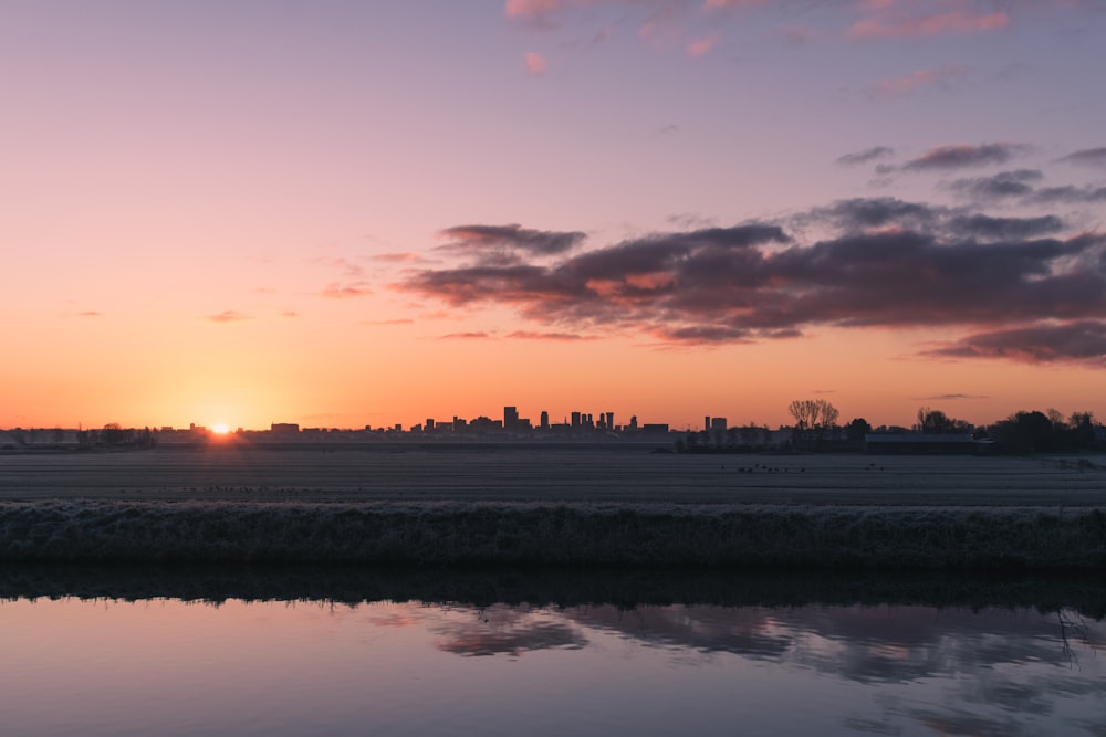 body of water during sunset