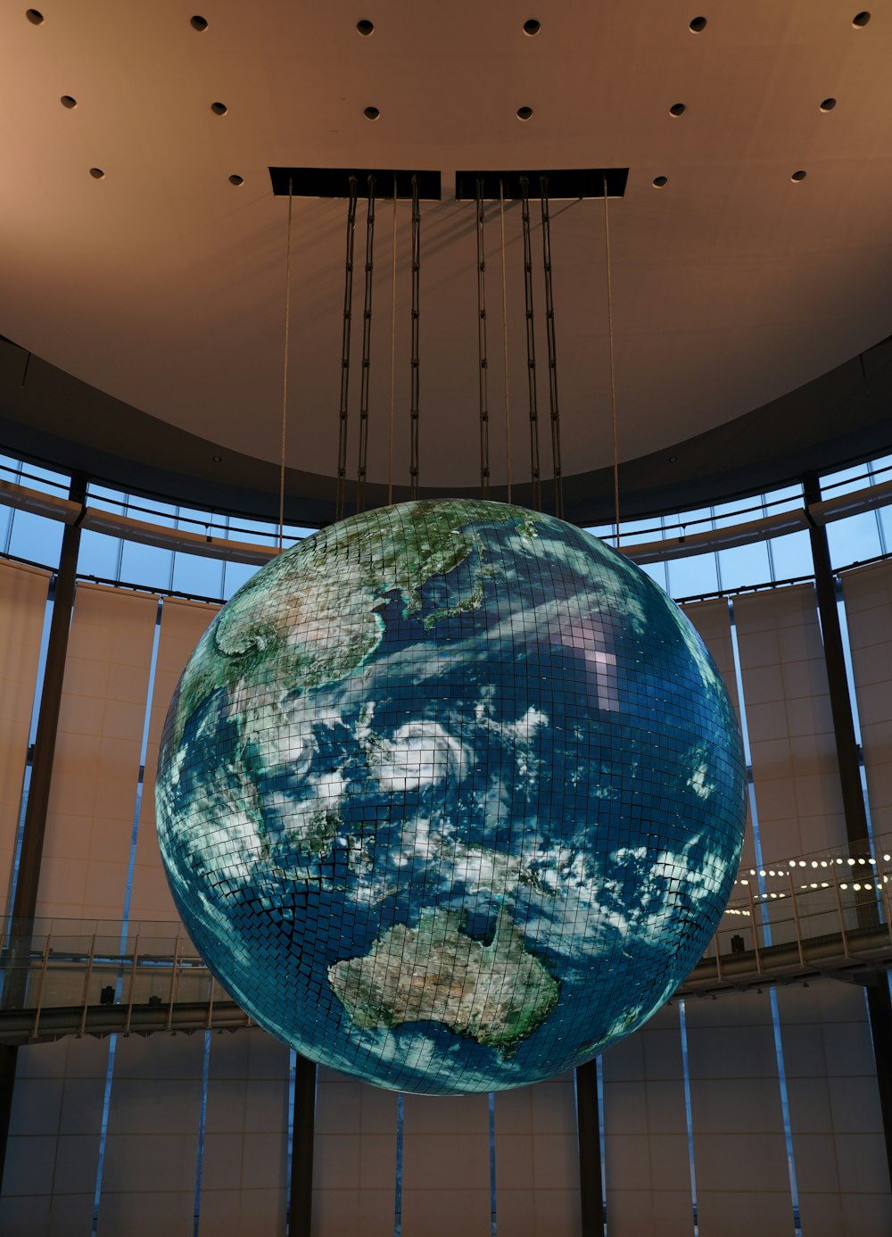 blue and brown globe inside building