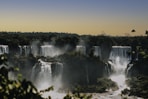 waterfalls under blue sky during daytime