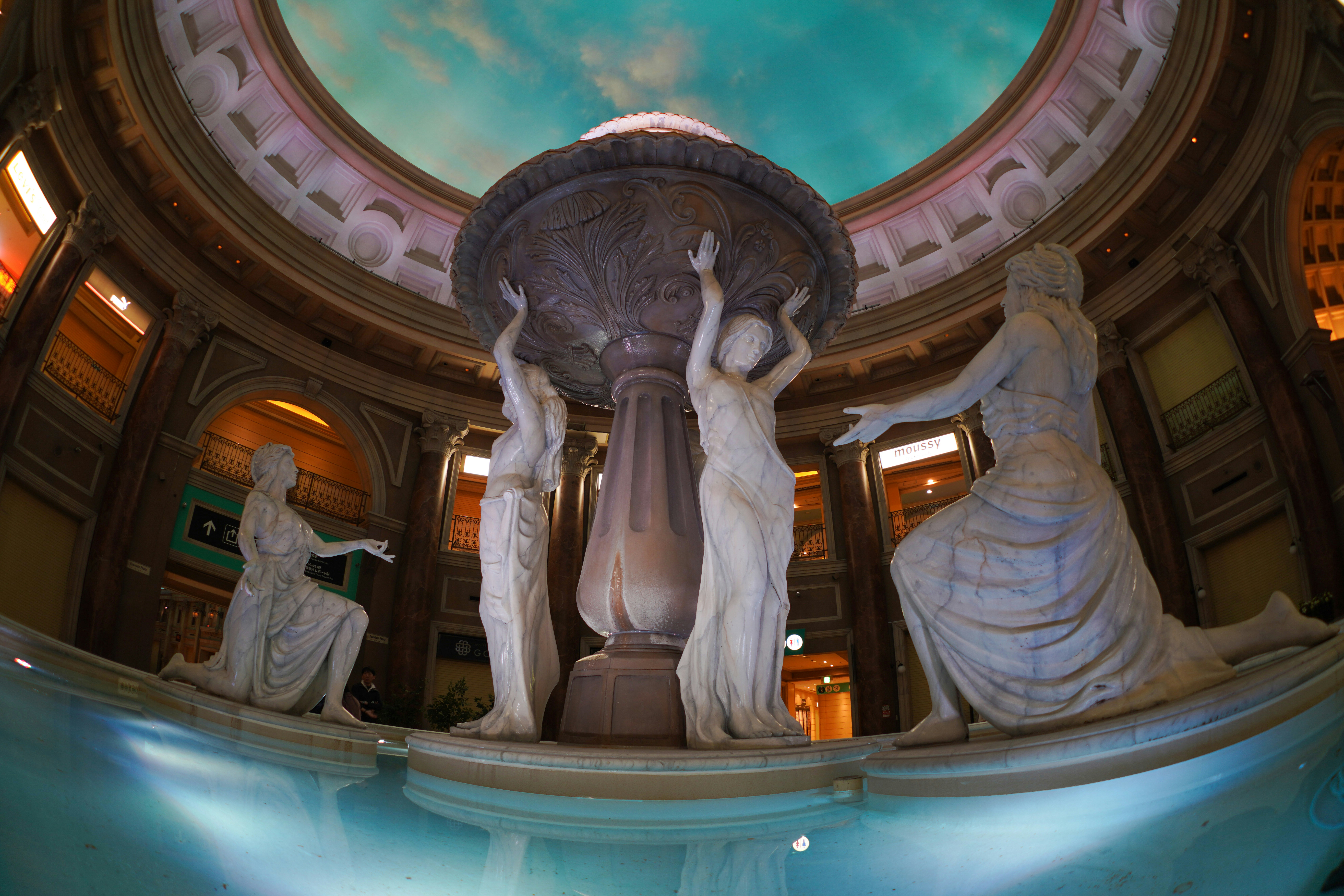 white concrete statue of man