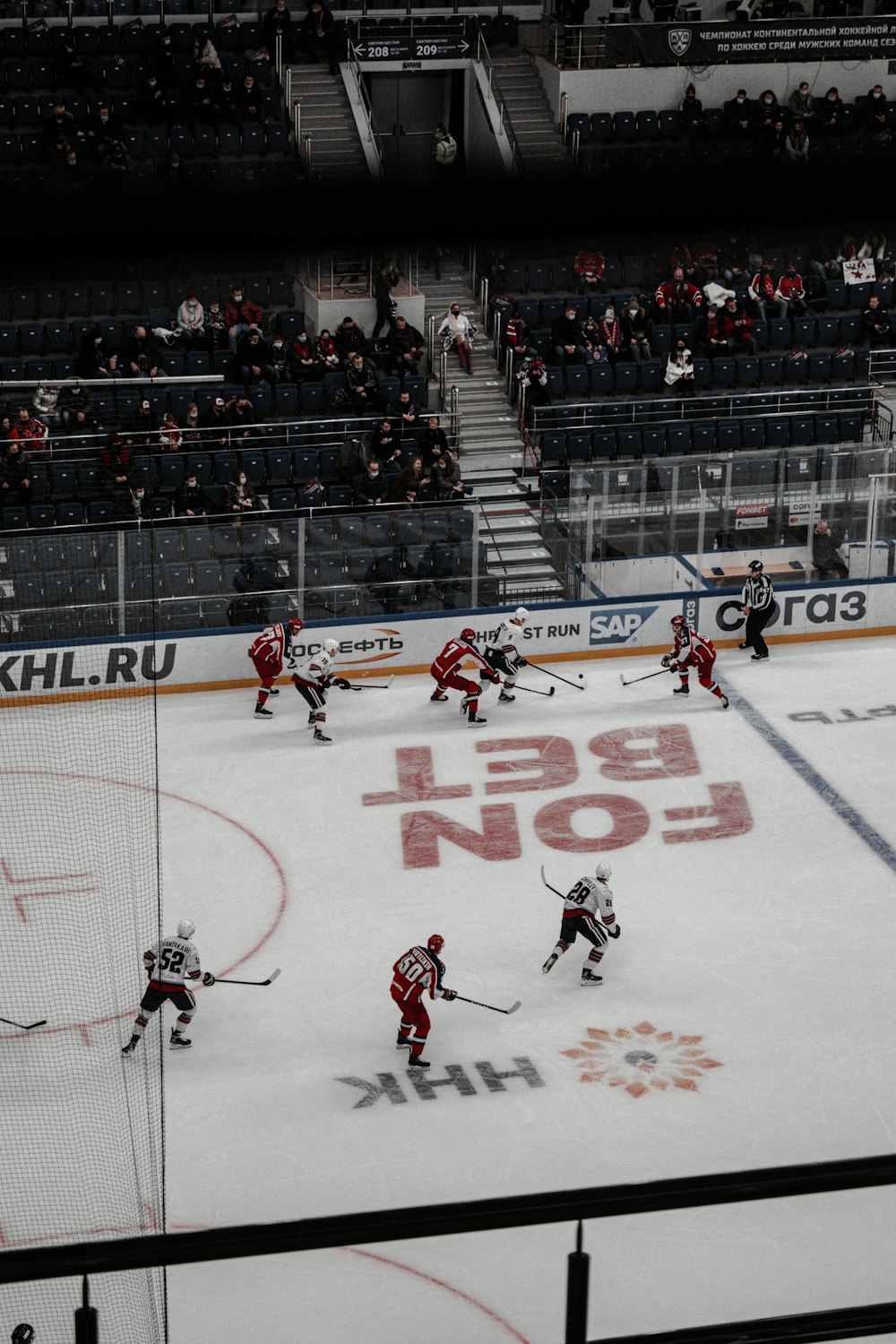 people playing ice hockey on court
