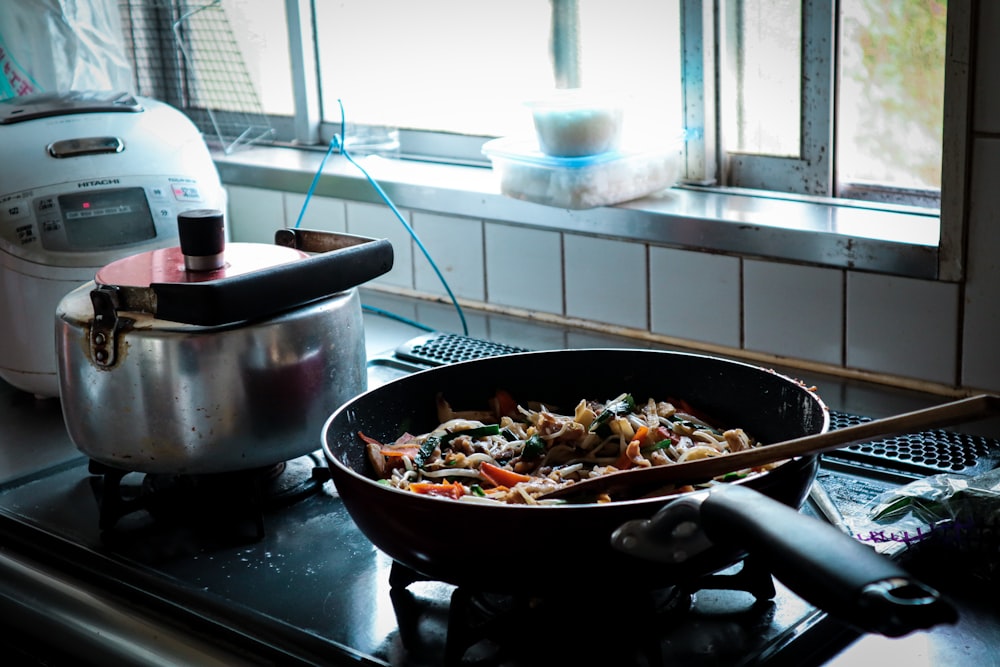 black cooking pan with food