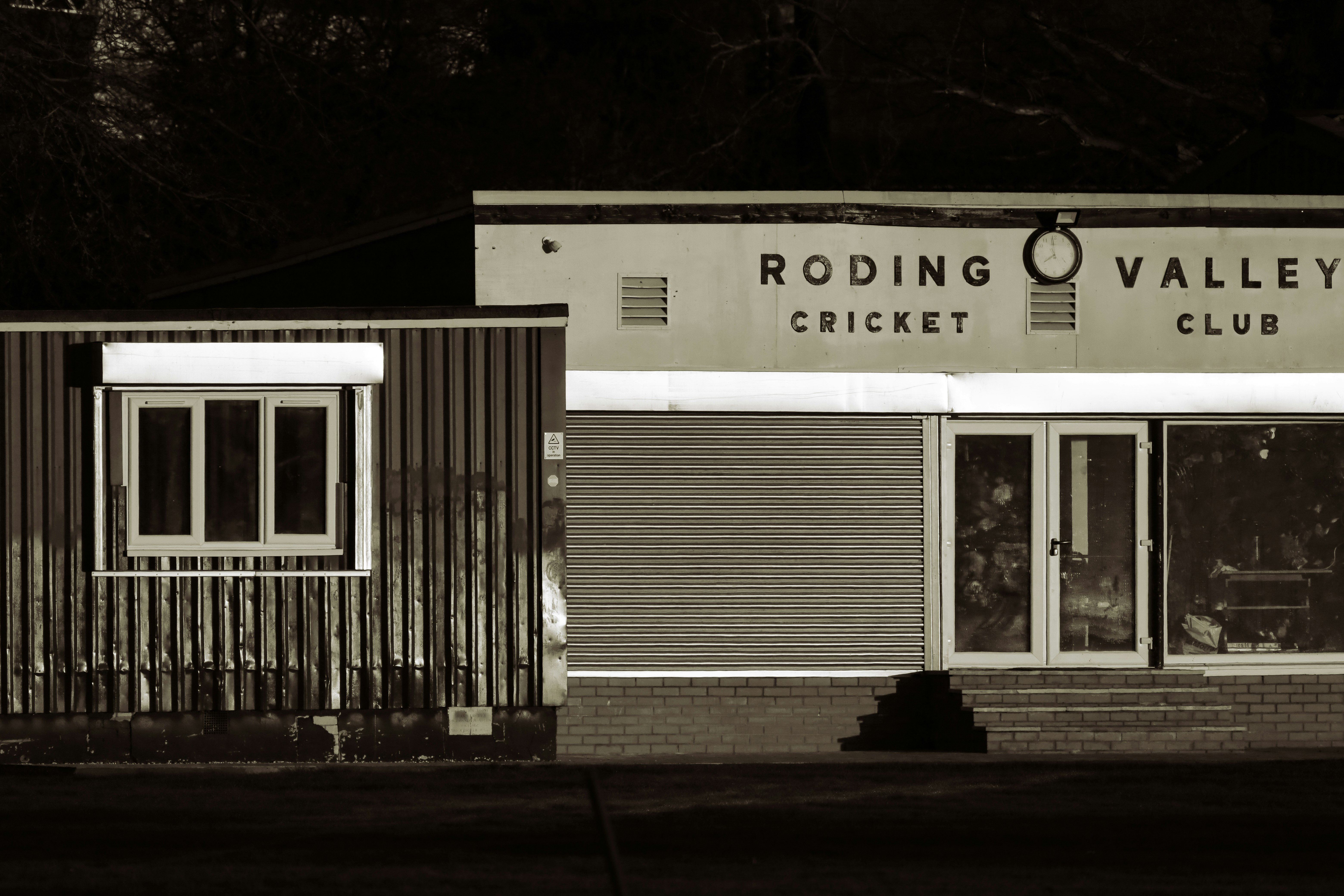 white and black wooden building during night time