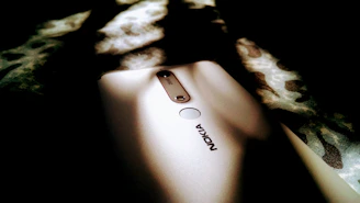 Nokia logo presented in a crisp, electric blue style on a dark minimalist background.
