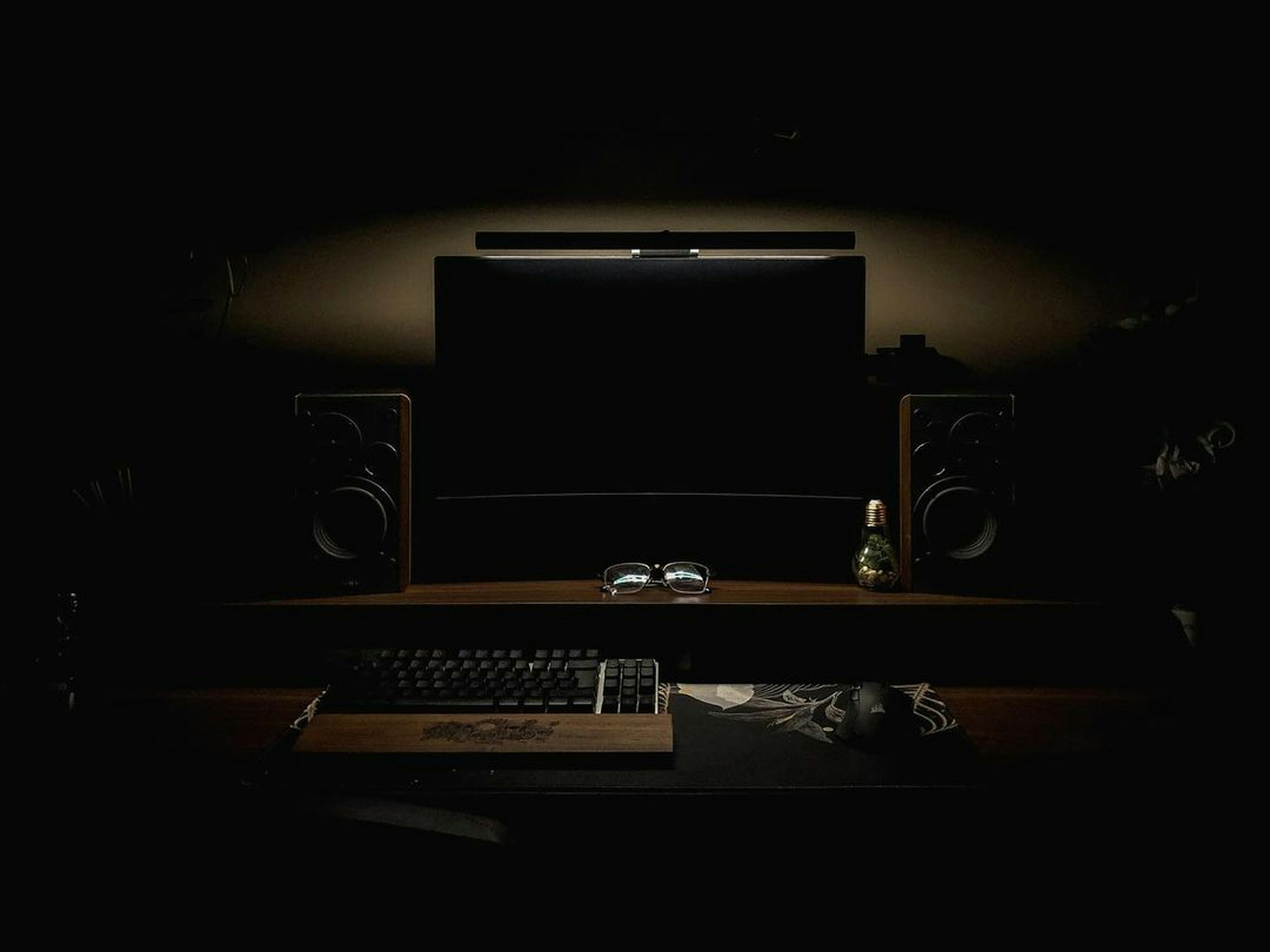 A bright workspace featuring a large monitor with an intuitive user interface on screen.