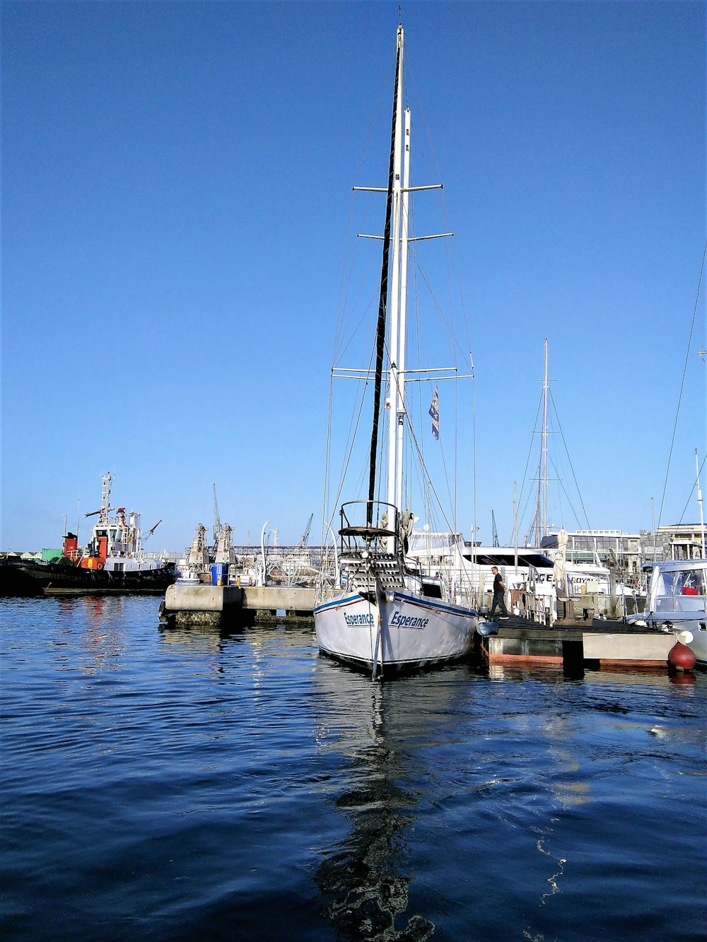 white and black boat on body of water during daytime