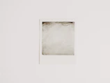 Minimalist empty gallery slot with subtle gray border.