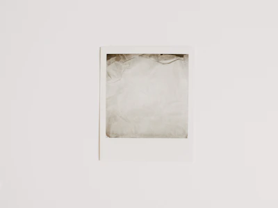 Minimalist empty gallery slot with subtle gray border.