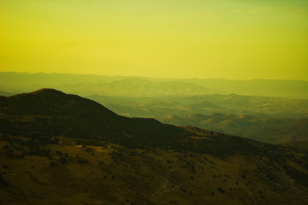 green mountains under white sky during daytime