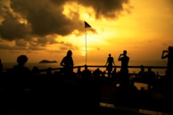 Sunset over the San Francisco Bay with a small group gathered for a traditional Tongan prayer circle.