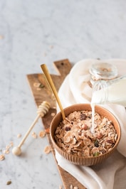 brown wooden bowl with brown powder
