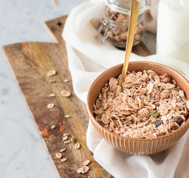 brown wooden spoon on white ceramic bowl