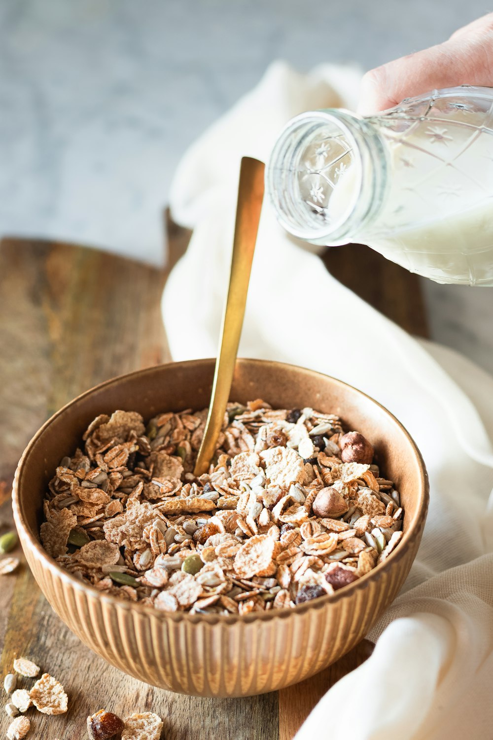 brown and white ice cream in brown ceramic bowl