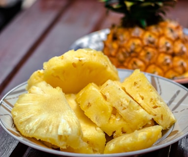 sliced pineapple on white ceramic plate