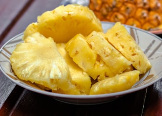 sliced pineapple on white ceramic plate