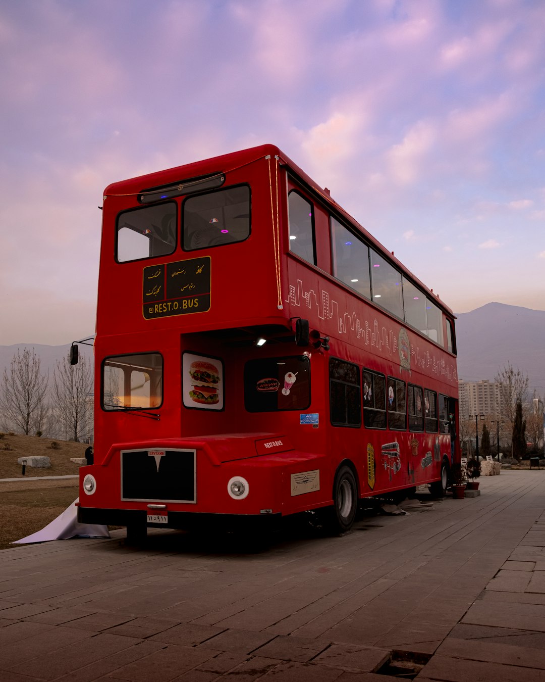 red double decker bus on road during daytime