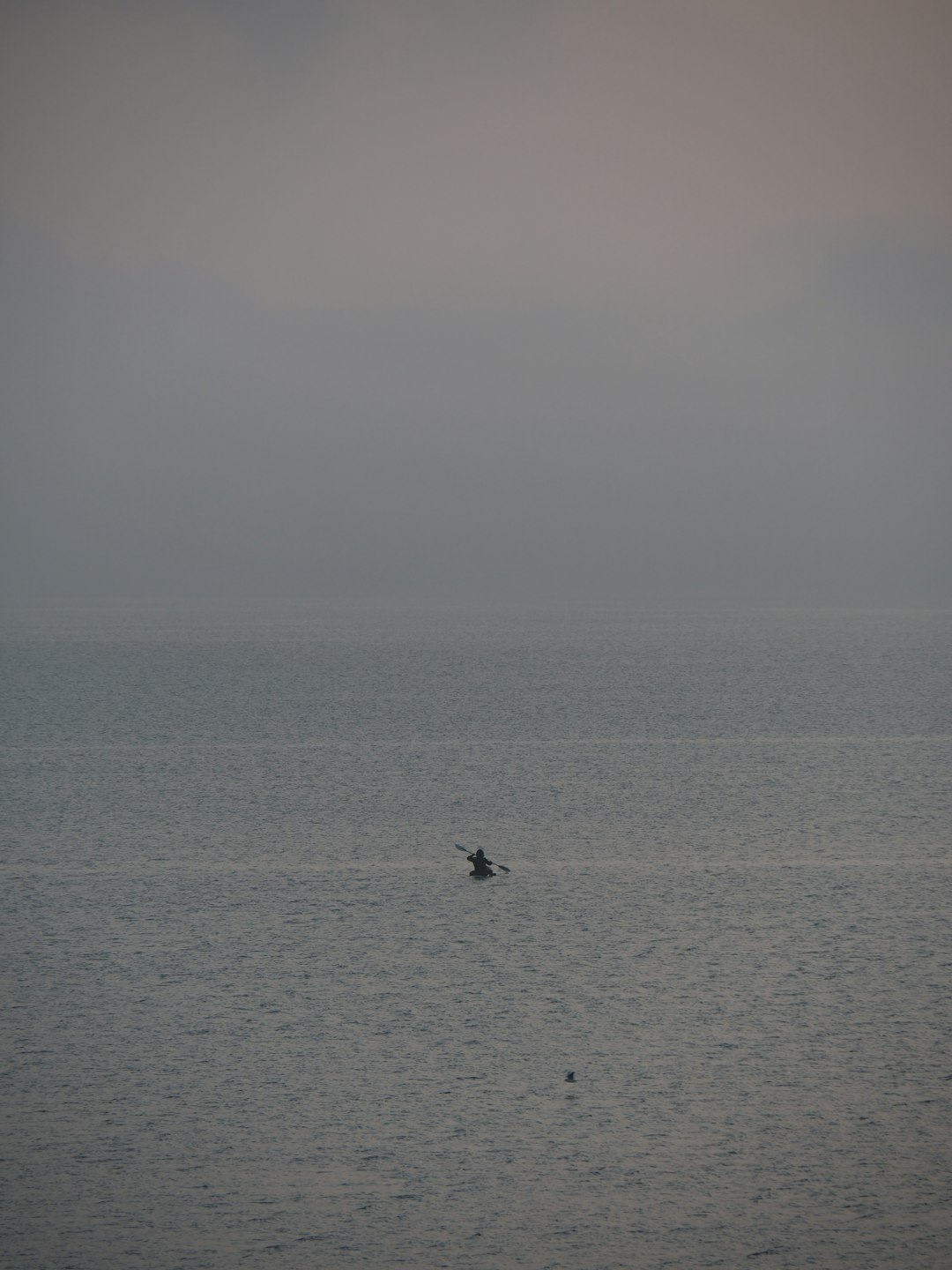person riding on boat on sea during daytime