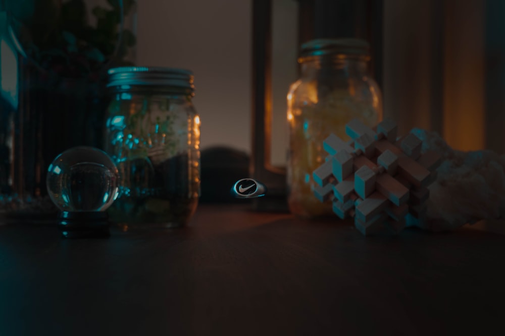 clear glass jar with white and blue beads