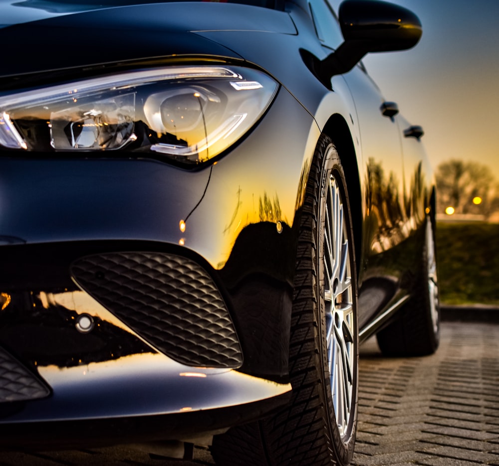 grayscale photo of car in a parking lot