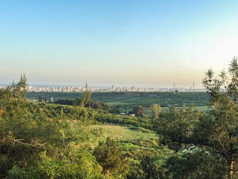 Expanding urban development next to green fields.