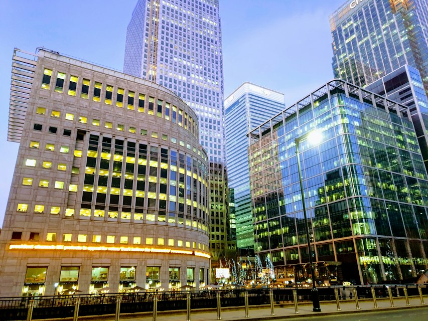 Modern financial-district architecture — independent delivery insight for financial services transformation