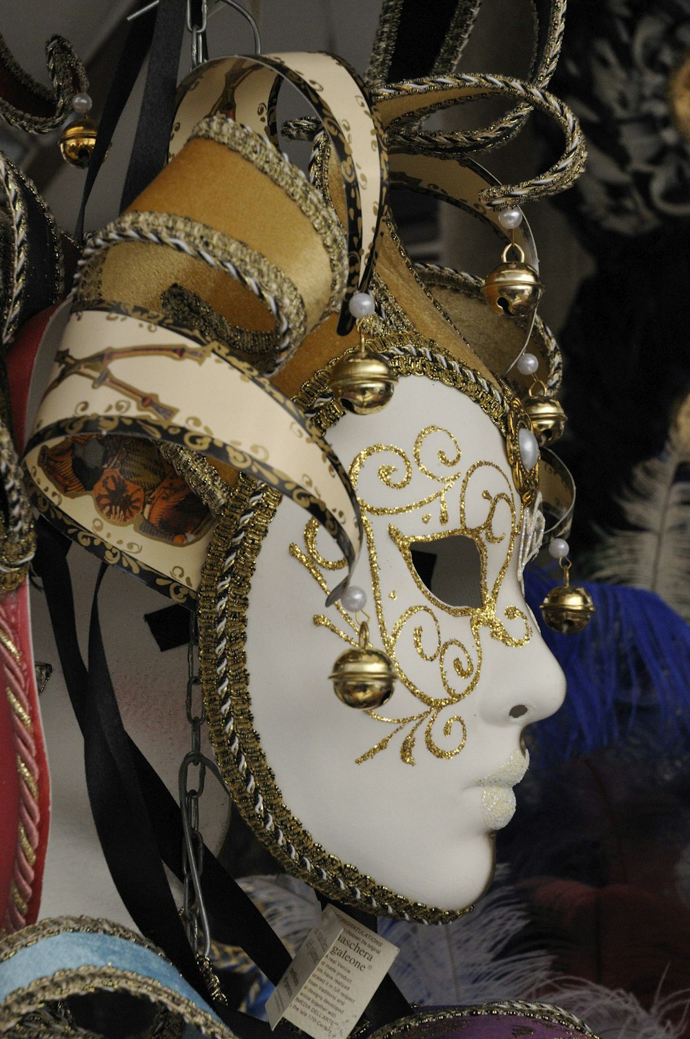 white and gold mask on persons face