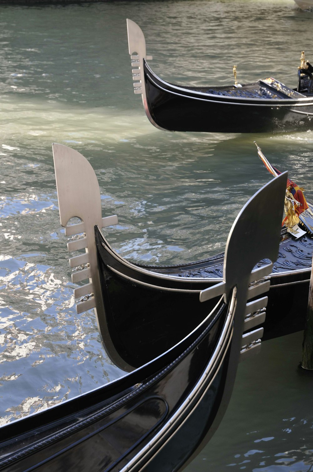 black and white boat on blue body of water during daytime