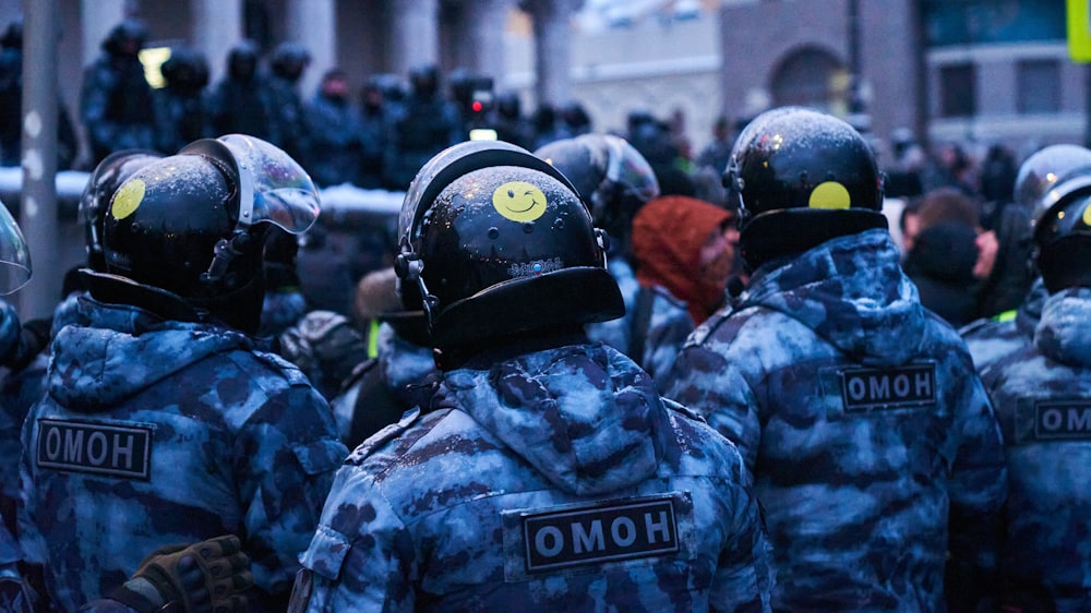 group of men in black and blue police uniform