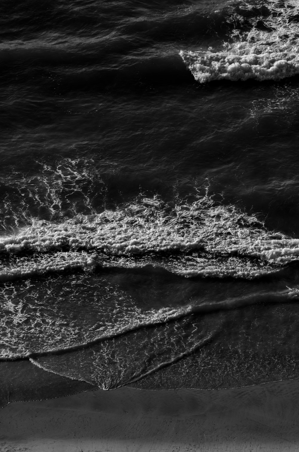 grayscale photo of water waves