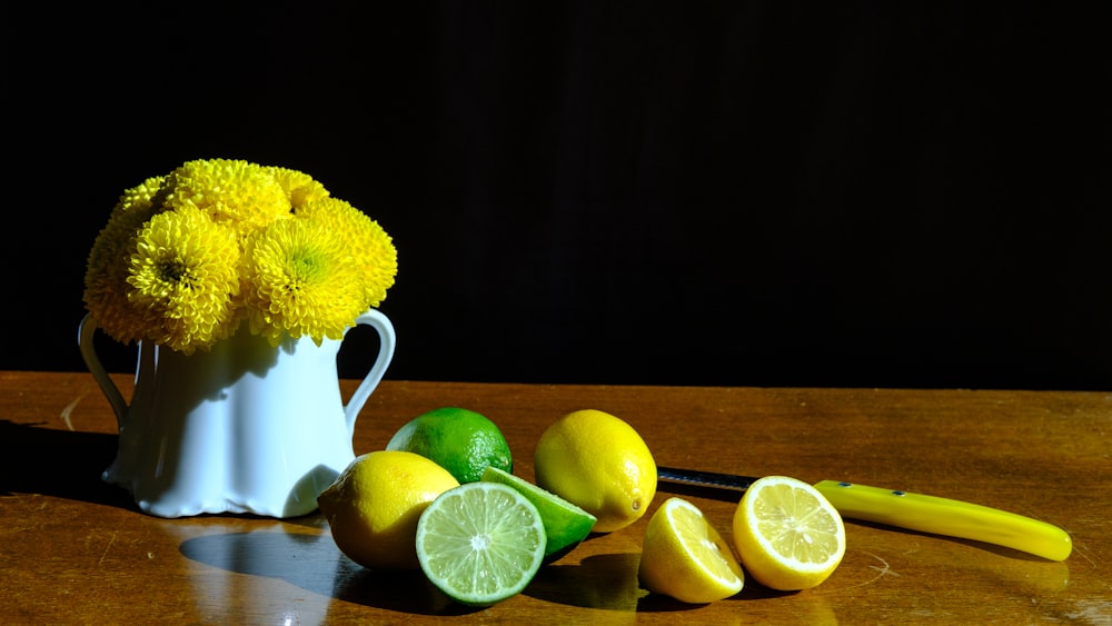 yellow lemon fruit on white ceramic mug