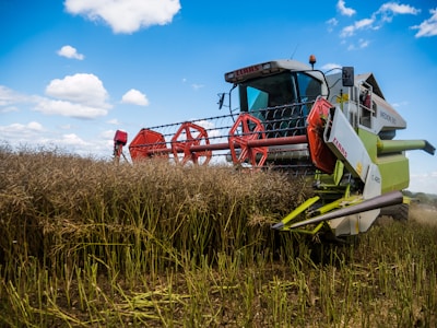 Close-up of a modern combine harvester efficiently gathering ripe crops.