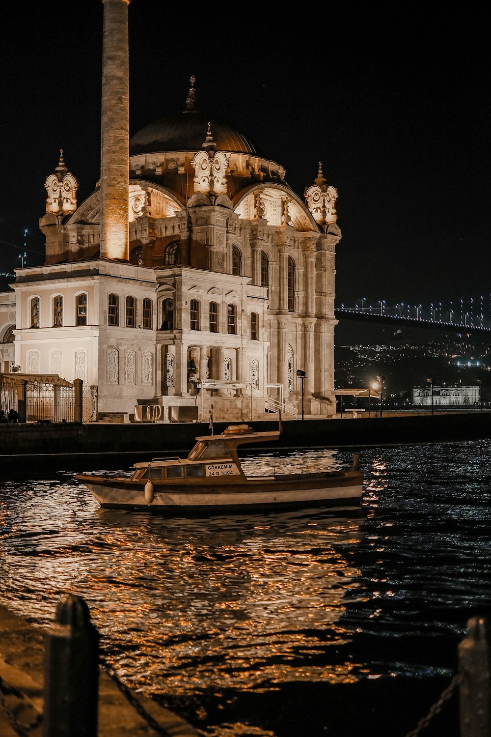 a boat is in the water in front of a building