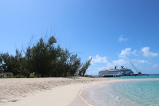 A panoramic view of the Bahamas port with crystal-clear turquoise waters and a cruise ship anchored