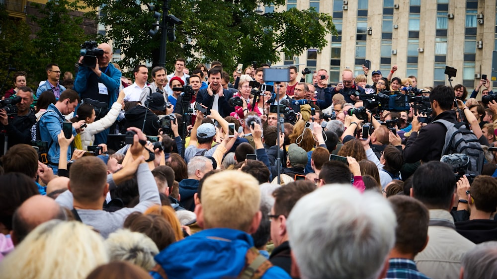 people gathering on street during daytime