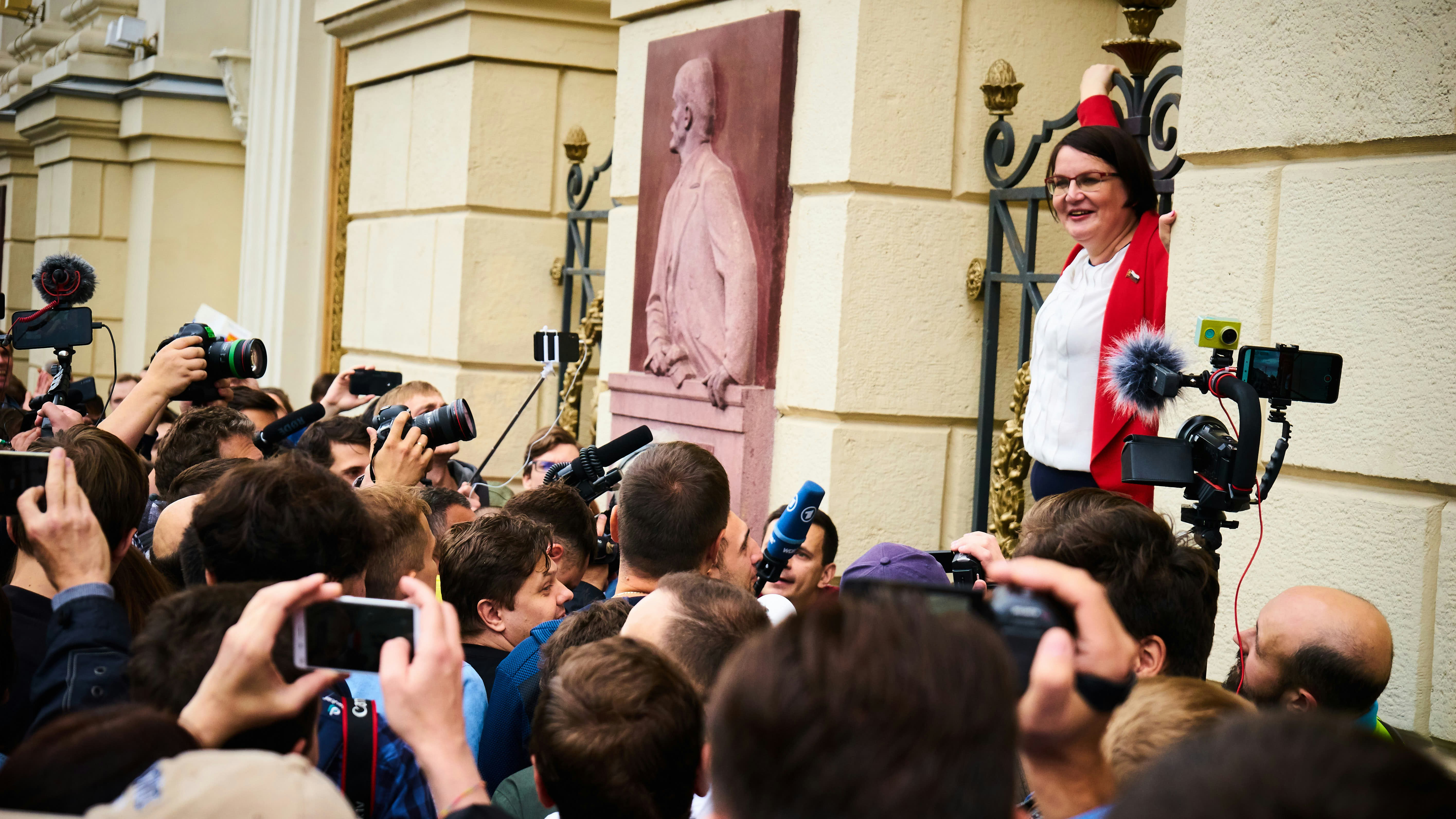 man in white long sleeve shirt standing near people during daytime, Photograph: Valery Tenevoy / https://plagness.com / July 14, 2019