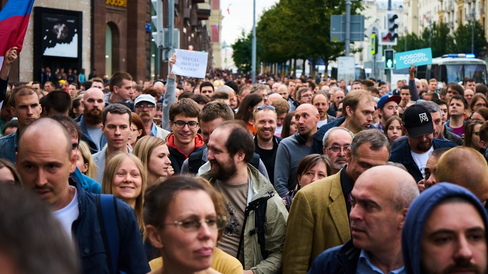 people gathering near brown building during daytime