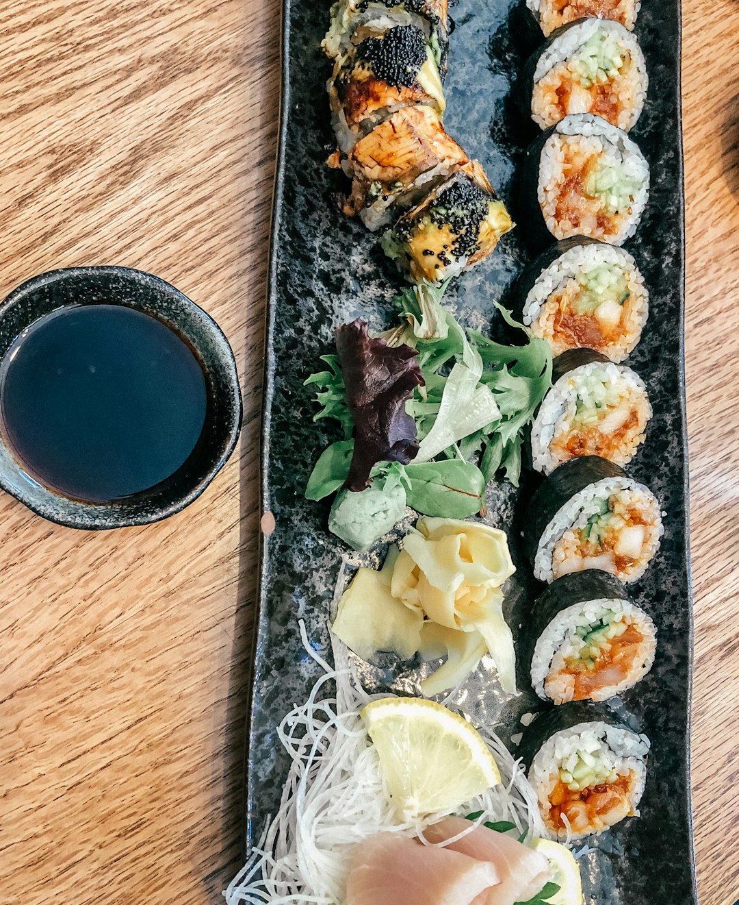 sushi on brown wooden table