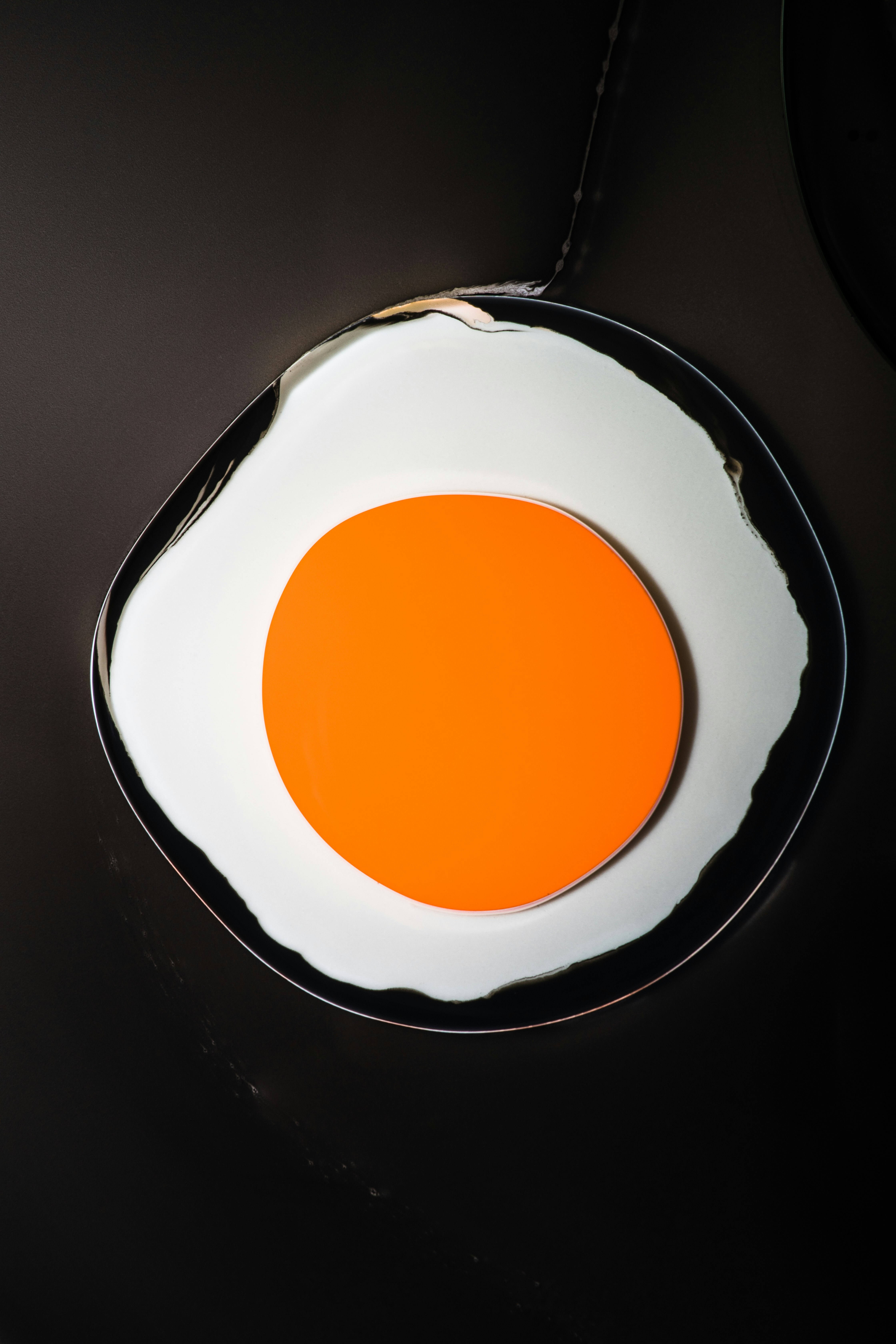 white and orange round plate