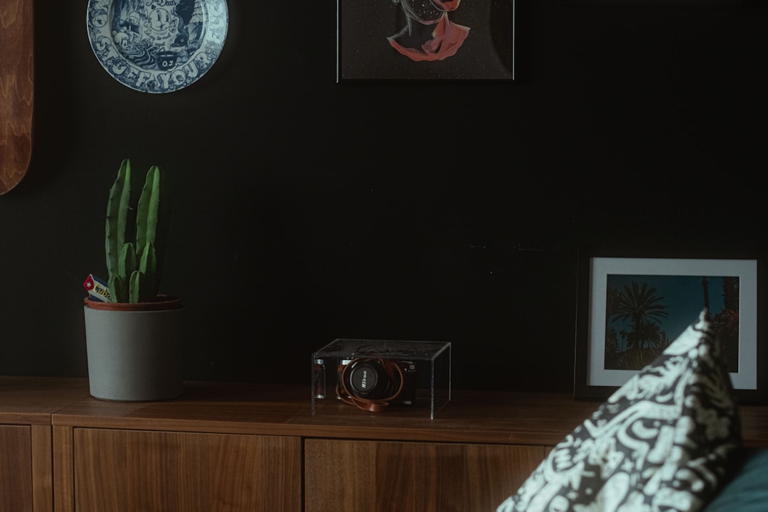 black flat screen tv on brown wooden tv rack