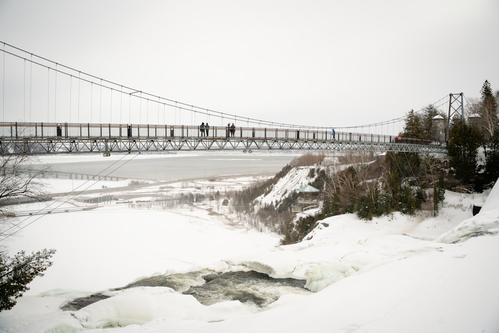 bridge over river covered with snow