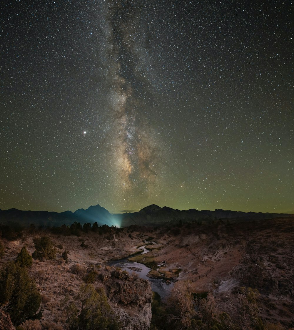 brown rocky mountain under starry night