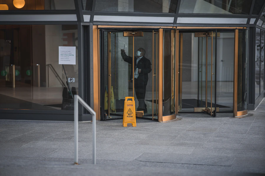 Commercial lobby entrance with a wet floor sign