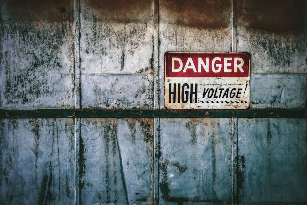 no smoking sign on gray wooden wall