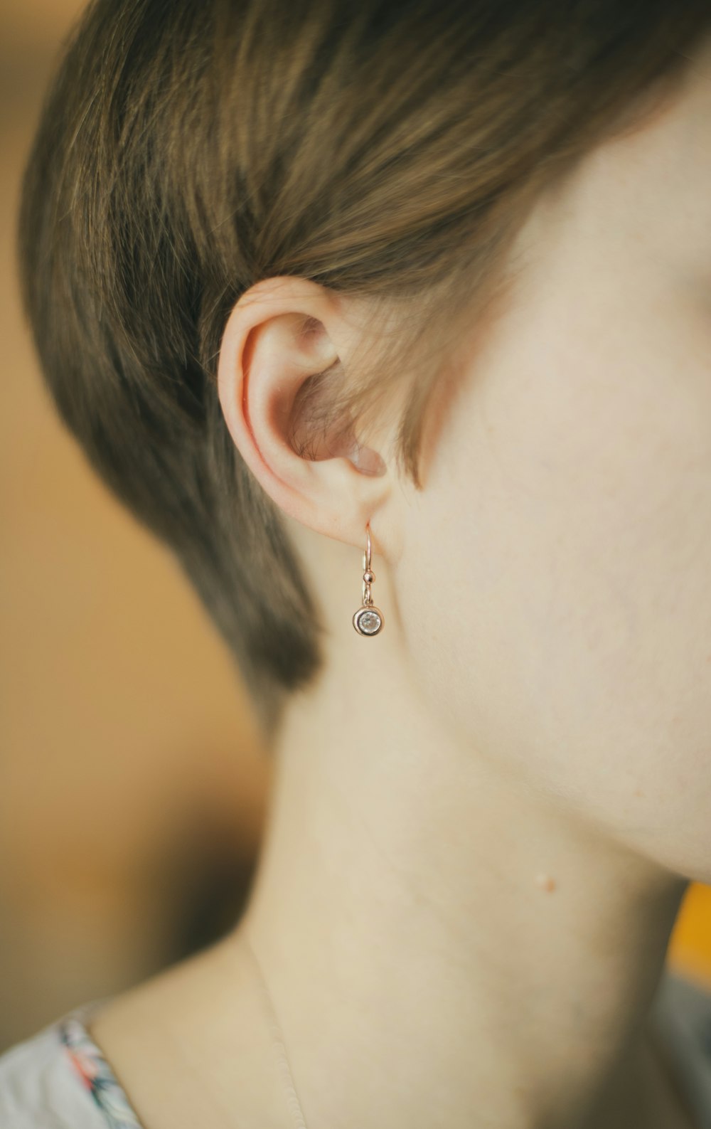 woman wearing silver stud earring