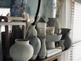 white ceramic vase on brown wooden table