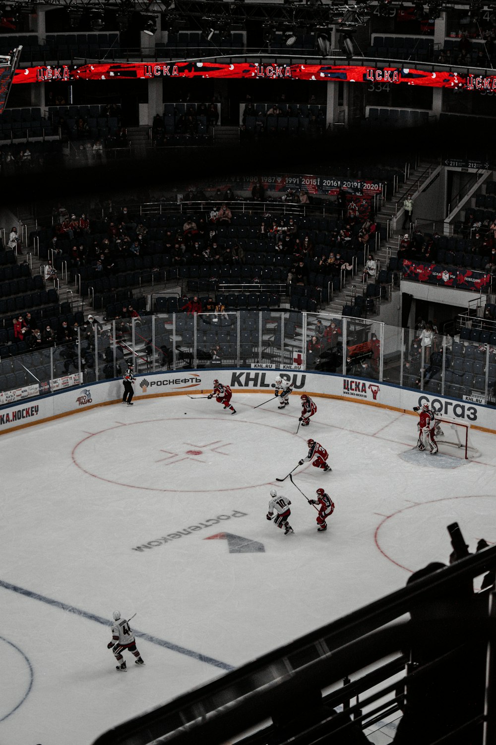 people playing ice hockey on ice stadium