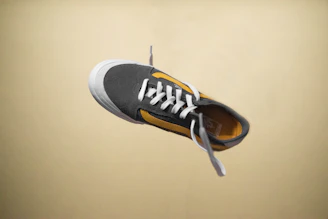 Dynamic shot of a sneaker mid-air, highlighting its bold design and vibrant colorway.