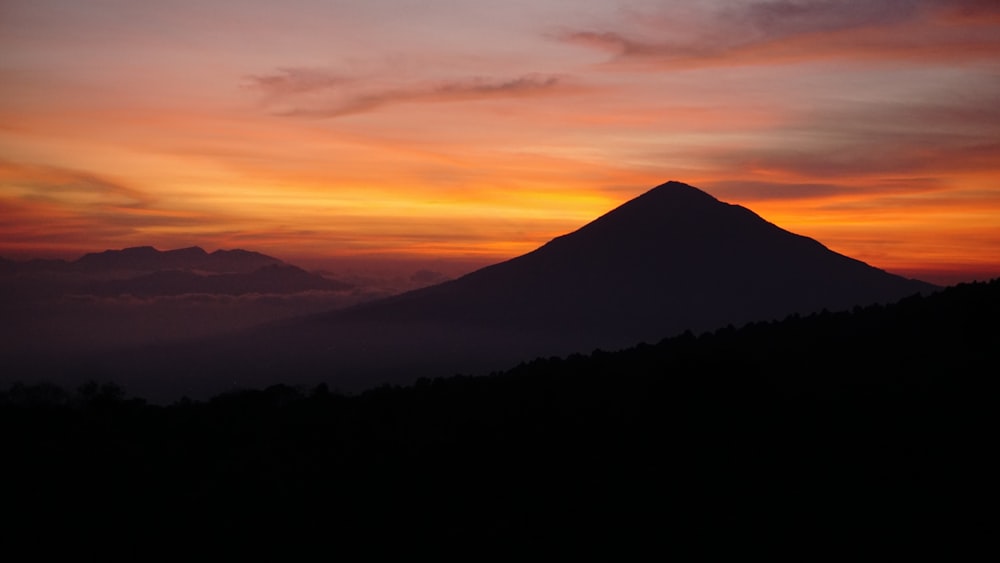 silhouette of mountain during sunset