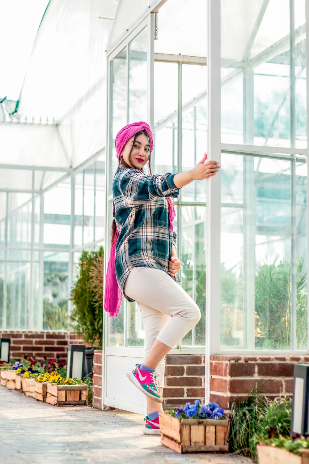 woman in blue and white plaid dress shirt and pink pants