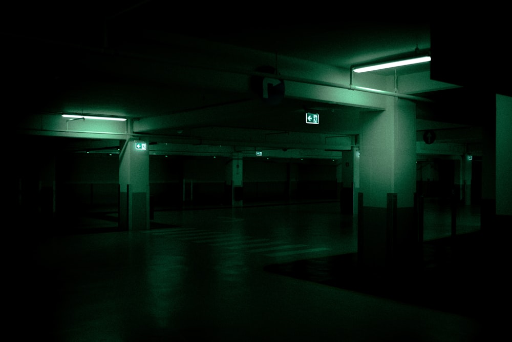 white and blue hallway with lights turned on during night time